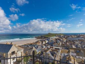 a view of a town and the beach at Alfred Wallis in St Ives