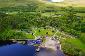 an aerial view of a park next to a lake at Milton Bay Luxury lodge wrapped in exceptional scenery in Morenish