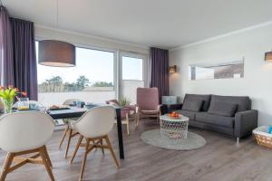 Ein Sitzbereich in der Unterkunft Apartmenthaus "Kiki", Wohnung "Traumbude"