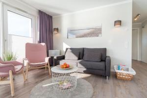 Ein Sitzbereich in der Unterkunft Apartmenthaus "Kiki", Wohnung "Traumbude"