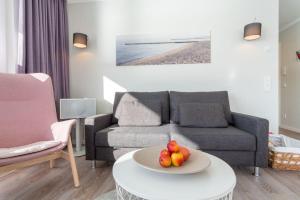 Ein Sitzbereich in der Unterkunft Apartmenthaus "Kiki", Wohnung "Traumbude"