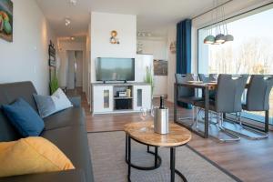 TV a/nebo společenská místnost v ubytování Apartmenthaus-Kiki-Wohnung-Kiek-in