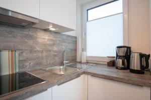 Kuchyň nebo kuchyňský kout v ubytování Apartmenthaus-Kiki-Wohnung-Kiek-in
