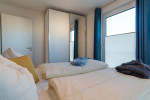 Postel nebo postele na pokoji v ubytování Apartmenthaus-Kiki-Wohnung-Kiek-in