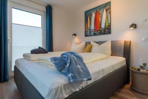 Postel nebo postele na pokoji v ubytování Apartmenthaus-Kiki-Wohnung-Kiek-in