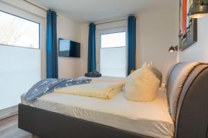 Postel nebo postele na pokoji v ubytování Apartmenthaus-Kiki-Wohnung-Kiek-in