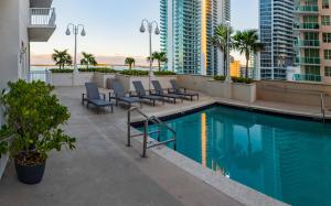 a swimming pool on the roof of a building at Luxury Accommodations Brickell in Miami