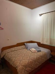Łóżko lub łóżka w pokoju w obiekcie Villa Lochia - Καλημέρι