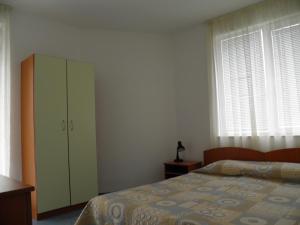 A bed or beds in a room at Family Hotel Maritime