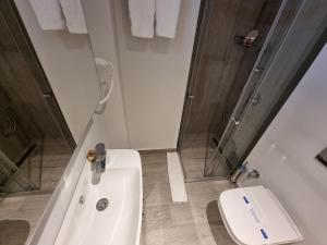 Koupelna v ubytování 10m2 Hotel