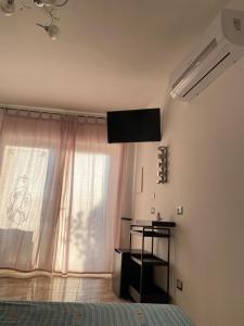 TV a/nebo společenská místnost v ubytování L'oasi del Tuffatore