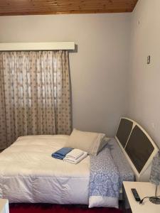 Łóżko lub łóżka w pokoju w obiekcie Villa Lochia