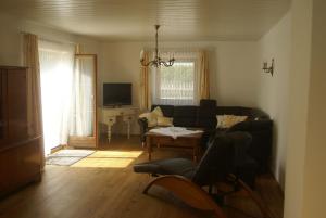 a living room with a couch and a table at Ferienhaus Füchslein in Bayerisch Gmain