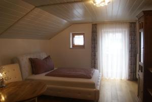 Ένα ή περισσότερα κρεβάτια σε δωμάτιο στο Ferienhaus Füchslein