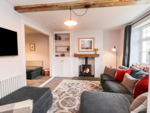 a living room with a couch and a fireplace at 29 Bondgate in York