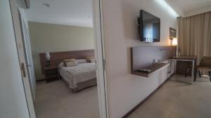 Postel nebo postele na pokoji v ubytování Hotel Estilo MB - Villa Carlos Paz