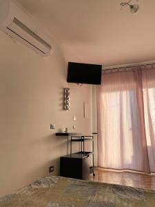 TV a/nebo společenská místnost v ubytování L'oasi del Tuffatore