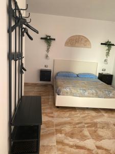 Postel nebo postele na pokoji v ubytování L'oasi del Tuffatore