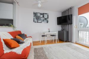a living room with a couch and a table at ShortStayPoland Chłodna (B74) in Warsaw