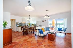 a living room with a couch and a table at Golubinka Apartments in Veli Rat
