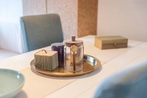 a tray with a candle on top of a table at LA BRIOSA-INFINITYHOLIDAYS in Costa Paradiso