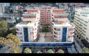an aerial view of a large building in a city at ELMAR HOTEL in Vlorë