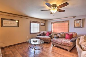 A seating area at Modern Deadwood Apt with Mountain Views and Grill!
