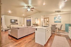a kitchen and living room with a couch and a table at Townhome with Private Hot Tub, 8 Mi to Downtown in Bozeman