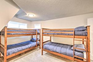 a room with three bunk beds in a house at Geodesic Dome House with Scenic Views and Hot Tub in Eatonville