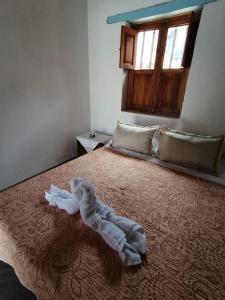 Un ou plusieurs lits dans un hébergement de l'établissement Hotel Villa Paz