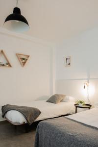 Ένα ή περισσότερα κρεβάτια σε δωμάτιο στο Apartamentos FV Flats Valencia - Mestalla 7