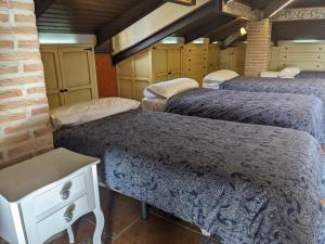Posteľ alebo postele v izbe v ubytovaní Villa El Rosal del Pozo