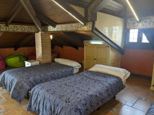 Posteľ alebo postele v izbe v ubytovaní Villa El Rosal del Pozo