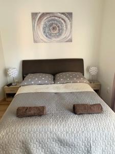 Posteľ alebo postele v izbe v ubytovaní Jade Apartman