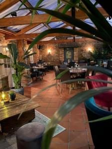a restaurant with tables and chairs in a building at Imaginarium rooms in Barton upon Humber