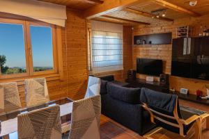 TV a/nebo společenská místnost v ubytování Casa de Madera en Calafell