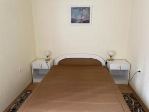 A bed or beds in a room at Piroska Apartment