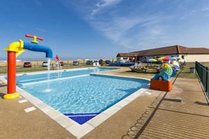 a swimming pool with a water park with a water slide at Casa Oliphaunt in Kent