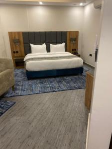 Ένα ή περισσότερα κρεβάτια σε δωμάτιο στο PRIMOTEL Elite As Salamah
