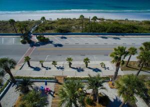 an aerial view of a tennis court with palm trees at Sabal Palms Inn in St. Pete Beach