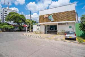 a car parked in front of a store at Hotel Vesta Boutique in Neiva