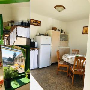 a kitchen with a white refrigerator and a table with chairs at Zulejka Vendégház in Mátraszele