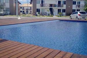 a large swimming pool in front of a building at Brisas do Lago I in Paulo Afonso