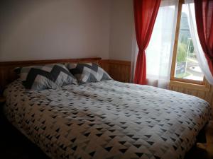 Cama o camas de una habitación en Hotel Cochamó