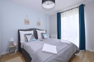 Säng eller sängar i ett rum på Beach&Sea&Sun Apartments