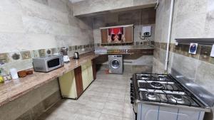 A kitchen or kitchenette at Alex sea view apartment - families only
