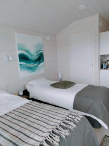 Een bed of bedden in een kamer bij B&B Villa Helmi