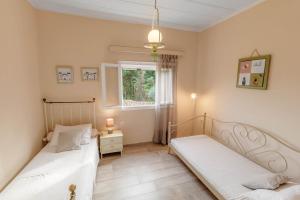 Ένα ή περισσότερα κρεβάτια σε δωμάτιο στο Pezouli, the real nature and village taste