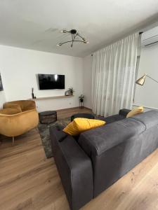 Televízia a/alebo spoločenská miestnosť v ubytovaní Apartment Kammi