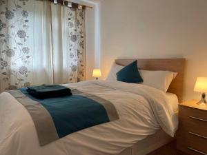 a bedroom with a large white bed and a window at Durham Eastside Professional Let - Durham city in Ushaw Moor